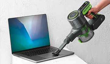 The image shows Polti Forzaspira D-Power SR500: the usage of the lance accessory on a laptop