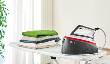 The image shows Polti Vaporella Instant on an ironing board